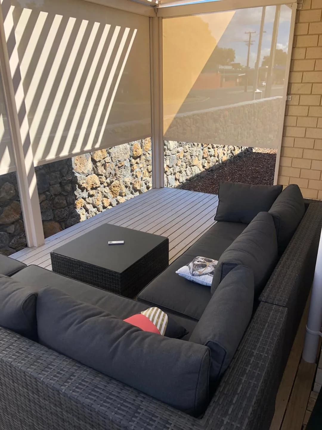 Outdoor blinds and glass panels closing in a patio